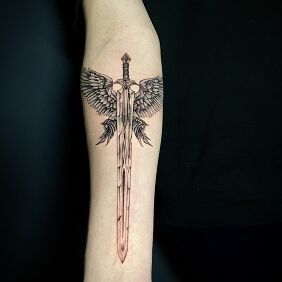 Tattoo Winged sword on the forearm motif: fantasy style: graphic / illustrative