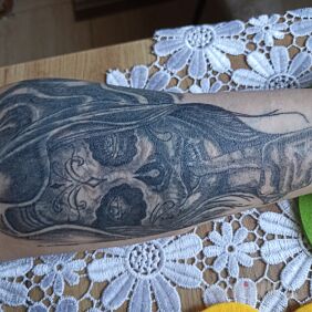 Tattoo Cover On the arm motif: santa muerte style: realistic