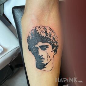 Tattoo Greek head on the forearm motif: faces style: graphic / illustrative