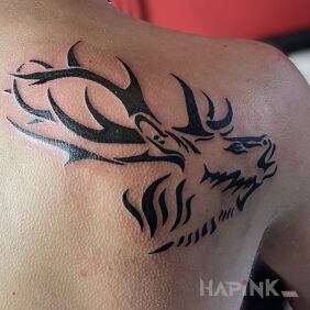 Tattoo Tribal deer on the shoulder blades motif: animals style: blackwork / blackout