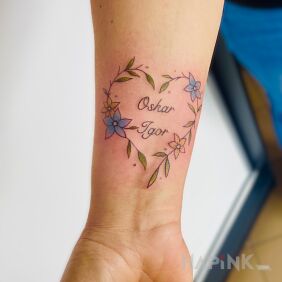 Tattoo Delicate floral heart with children's names On the arm style: graphic / illustrative
