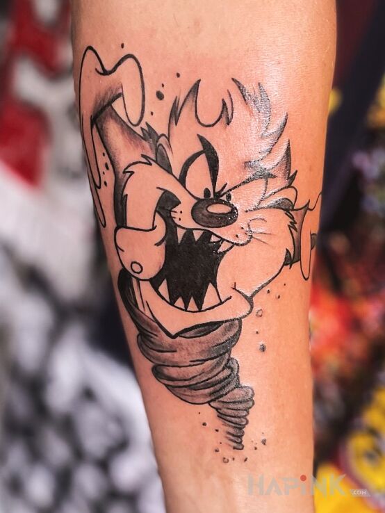 Tattoo Tasmanian Devil in characters motif and cartoon / comic book style on the forearm