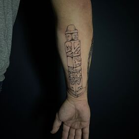 Tattoo Swiatowid statue on the forearm motif: black and gray style: graphic / illustrative