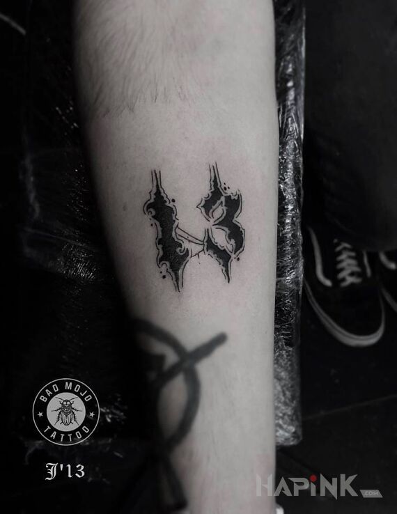 Tattoo Szczęśliwa "13" in other motif on the forearm