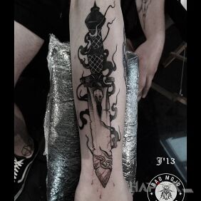 Tattoo Dagger on the leg motif: demons