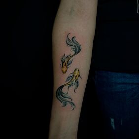 Tattoo Two symmetrical fish on the forearm motif: animals style: graphic / illustrative