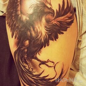 Tattoo Animal phoenix on the thigh motif: animals style: realistic