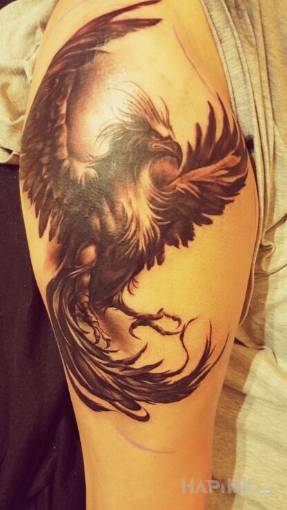Tattoo Animal phoenix in fantasy motif and realistic style on the leg