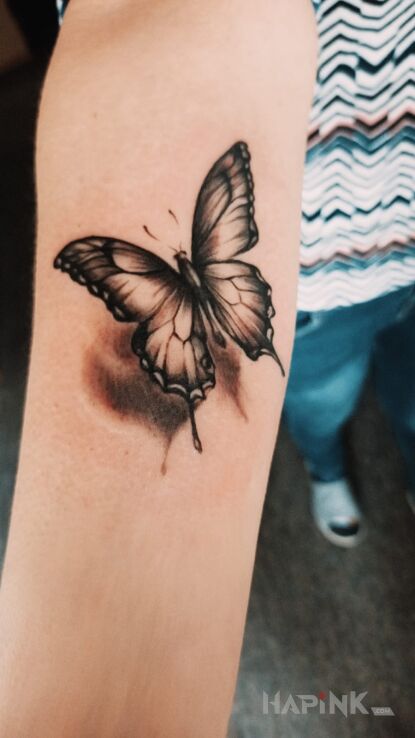 Tattoo Butterfly in butterflies motif and realistic style on the forearm