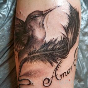Tattoo Hummingbird + inscription On the arm motif: lettering style: realistic