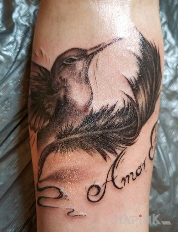 Tattoo Hummingbird + inscription in lettering motif and realistic style On the arm