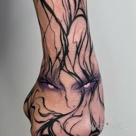 Tattoo Anime eyes On the arm motif: black and gray style: graphic / illustrative