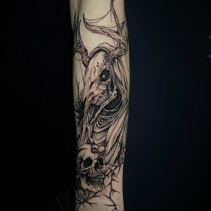 Tattoo Leszy forearm in dark motif and graphic / illustrative style On the arm