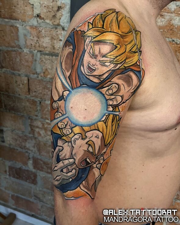 Tattoo Dragon ball in manga / anime motif and cartoon / comic book style on the upper arm