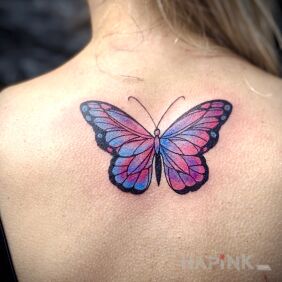 Tattoo Colorful butterfly on the back motif: colorful style: graphic / illustrative