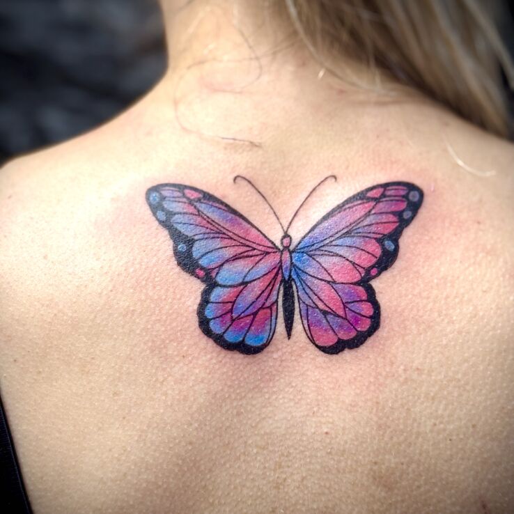 Tattoo Colorful butterfly in butterflies motif and graphic / illustrative style on the back