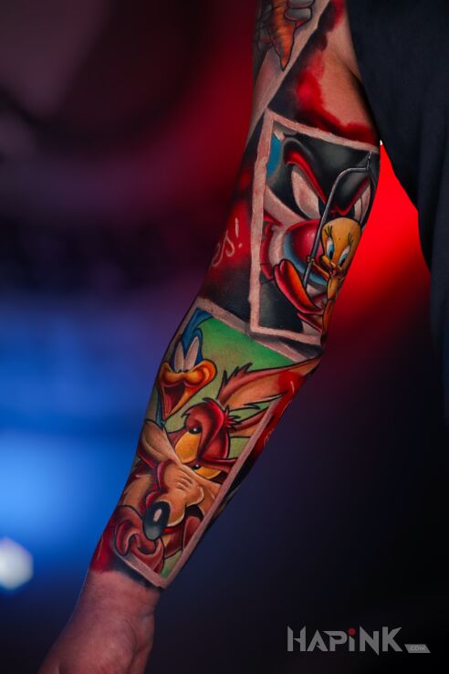 Tattoo Looney Tunes Sleeve in colorful motif and newschool style on the bicep