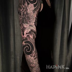 Tattoo Japanese style flower sleeve on the forearm motif: sleeves style: blackwork / blackout