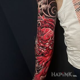 Tattoo Red Japanese lion on the bicep motif: demons style: japanese / irezumi