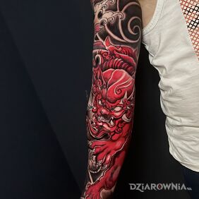 Tatuaż Czerwony japoński lew na ręce motyw: demony styl: japońskie / irezumi