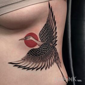 Tattoo A crane with a Japanese flair on the ribs motif: colorful style: graphic / illustrative