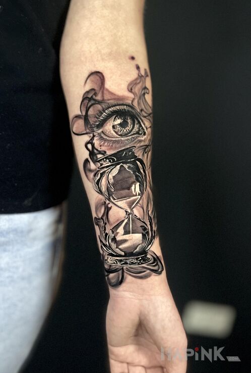 Tattoo Hourglass eye realism forearm in black and gray motif and realistic style On the arm