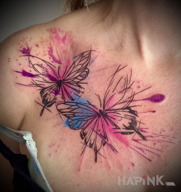 Tattoo Watercolor butterflies in colorful motif and Watercolor style on the collarbone