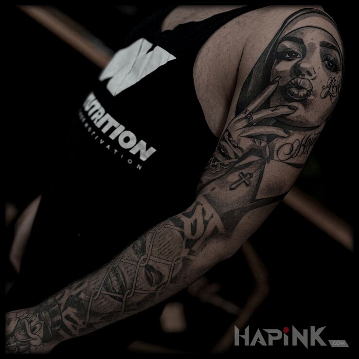 Tattoo Whole sleeve in criminal lettering motif and dotwork style on the hand