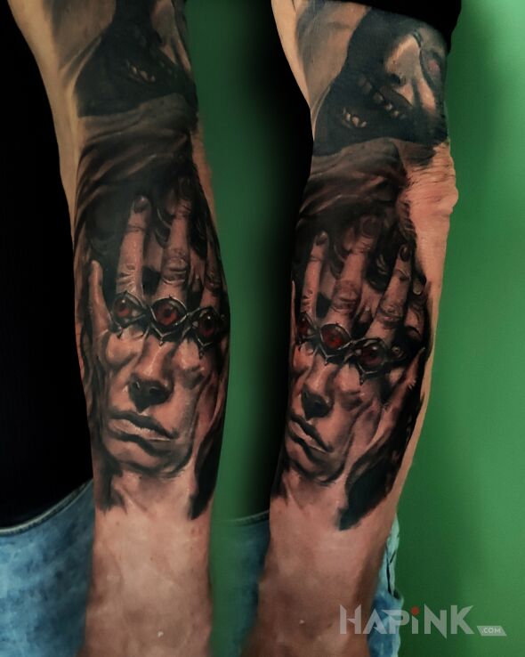Tattoo Dark Hand in black and gray motif and realistic style On the arm