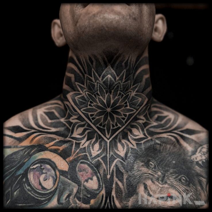 Tattoo Mandala on the neck in black and gray motif and geometric style on the neck