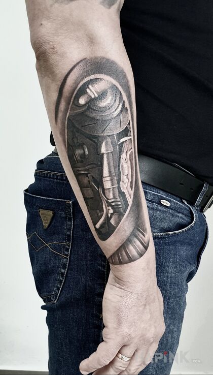 Tattoo Mechanics in objects motif and realistic style on the forearm