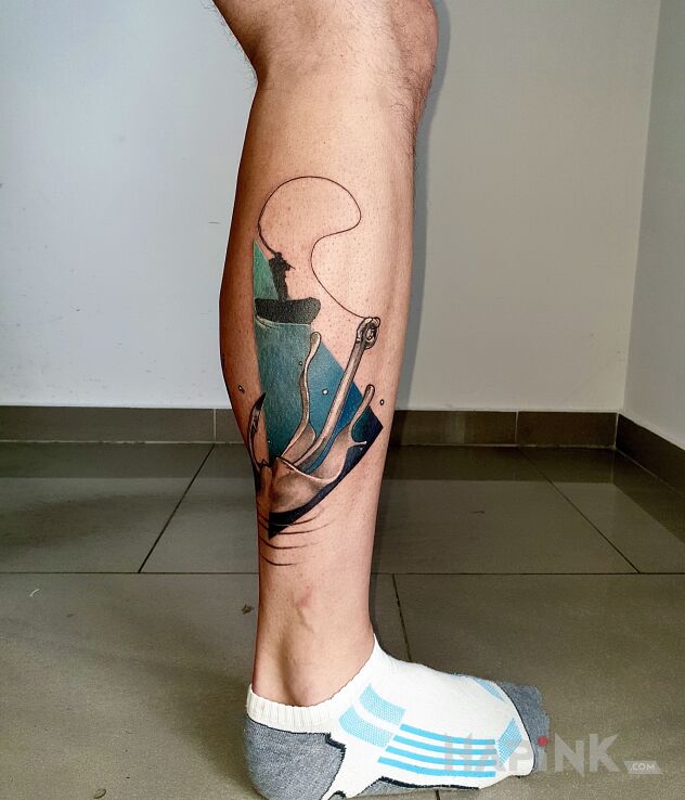 Tattoo Angler on a boat in colorful motif and modern / cubism style on the calf