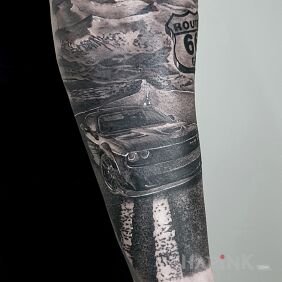 Tattoo Route 66 on the forearm motif: black and gray style: realistic