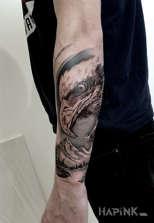 Tattoo Eagle in nature motif and realistic style On the arm