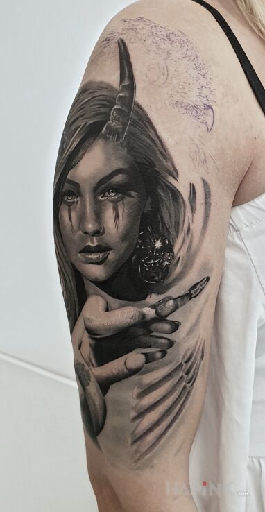 Tattoo Infernal goddess in dark motif and realistic style On the arm