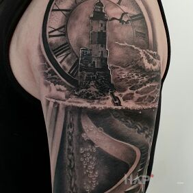 Tattoo A beacon of time On the arm motif: black and gray style: realistic