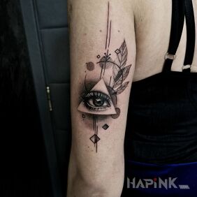 Tattoo Female eye on the upper arm style: dotwork