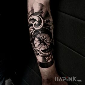 Tattoo Compass on the forearm motif: black and gray style: realistic