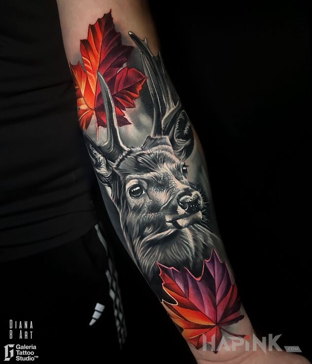 Tattoo Stag accompanied by colorful leaves in 3D motif and realistic style on the forearm