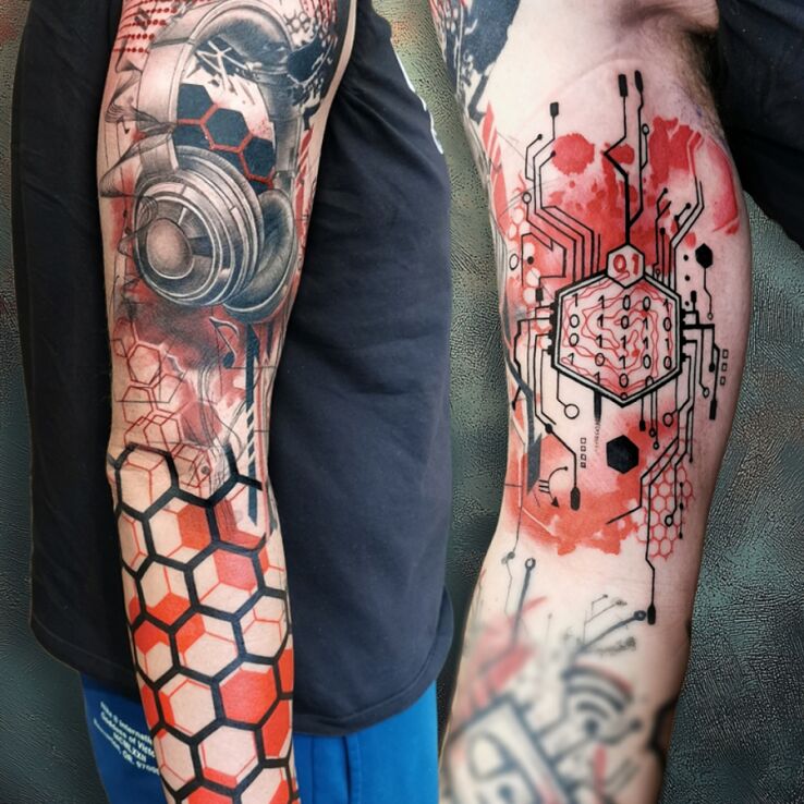 Tattoo Music and technology in objects motif and trash polka style on the bicep
