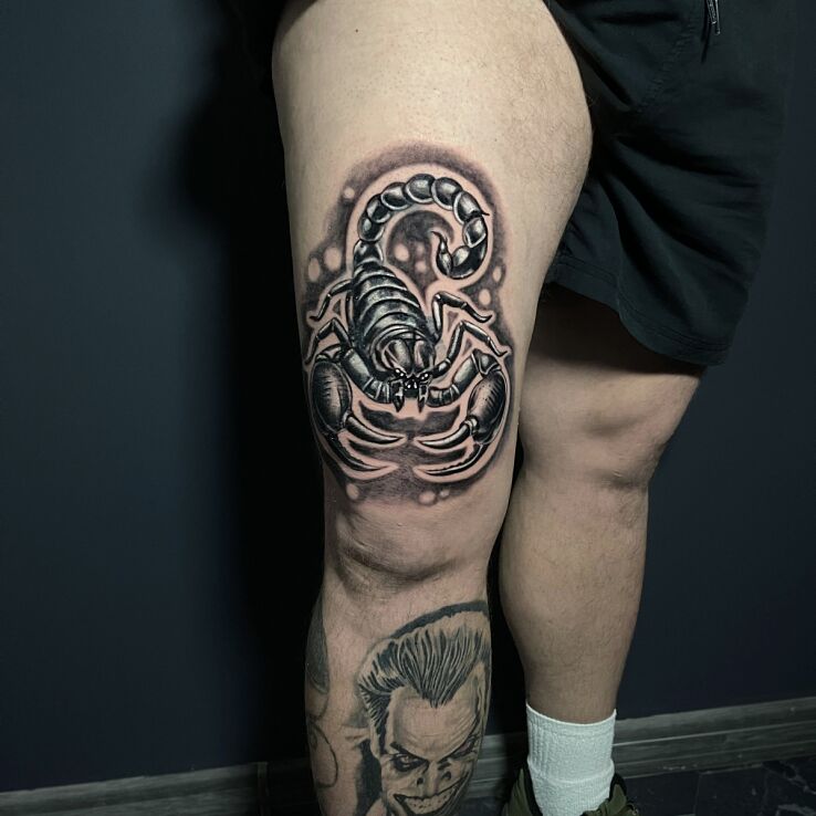 Tattoo Scorpio thigh in zodiac signs motif and realistic style on the thigh