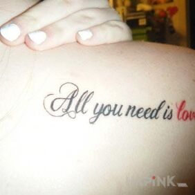 Tattoo Love and nothing more on the shoulder blades motif: lettering