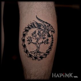 Tattoo Viking-style dragon and door on the calf motif: black and gray style: Celtic / Nordic