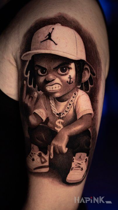 Tattoo Bad Boy in black and gray motif and realistic style on the upper arm