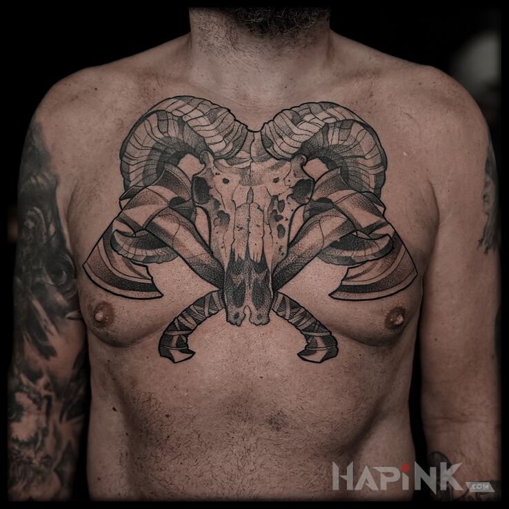 Tattoo A ram's skull and two axes in objects motif and graphic / illustrative style on the chest