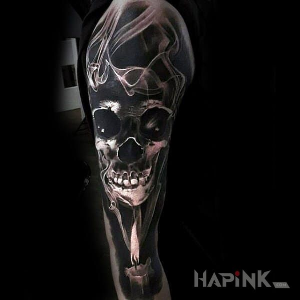Tattoo Czaszka w dymie in skulls motif and realistic style on the forearm