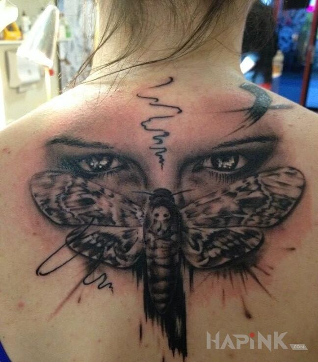 Tattoo Oczy na cykadzie in butterflies motif and realistic style on the back