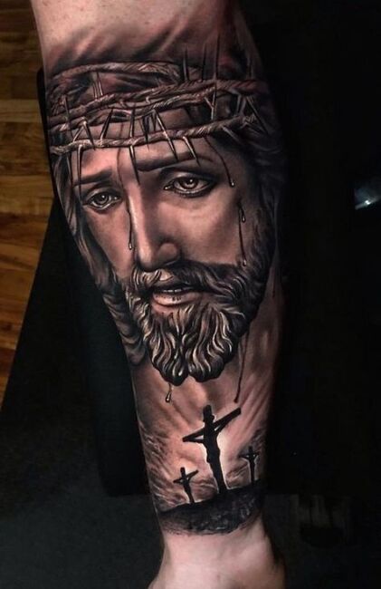 tatuaż na przedramieniu portret jezusa