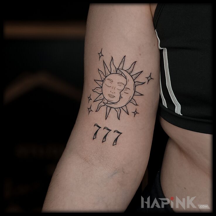 Tattoo Sun and moon in black and gray motif and graphic / illustrative style On the arm