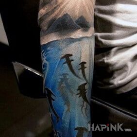 Tattoo Shark herd on the upper arm motif: animals